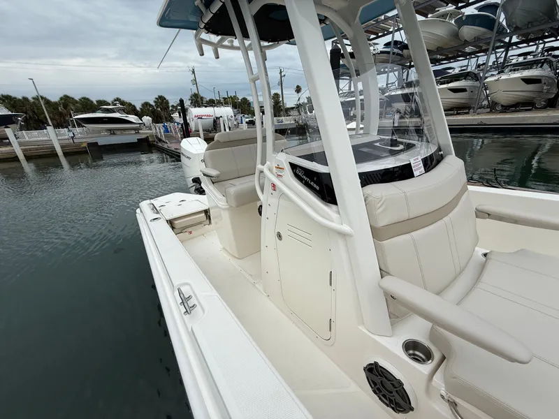 Slide: The Image of Boston Whaler 250 Dauntless 2026 at dock, modern design. - 9