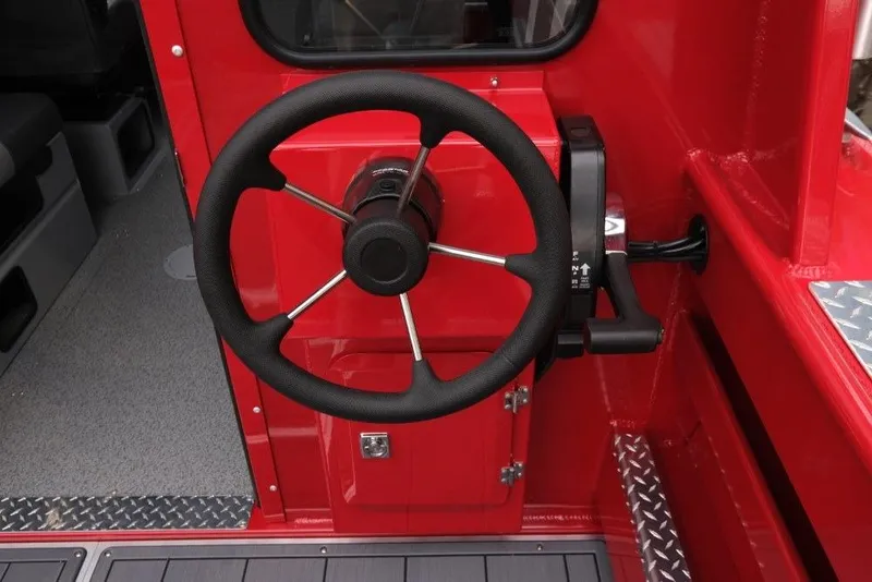 Slide: The Image of Steering wheel of 2026 Hewescraft 240 Ocean Pro ET Hardtop boat, red interior. - 10