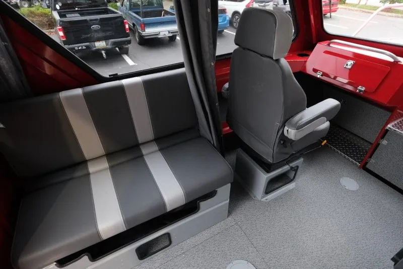 Slide: The Image of Interior of 2026 Hewescraft 240 Ocean Pro ET Hardtop, featuring seating and dashboard. - 12