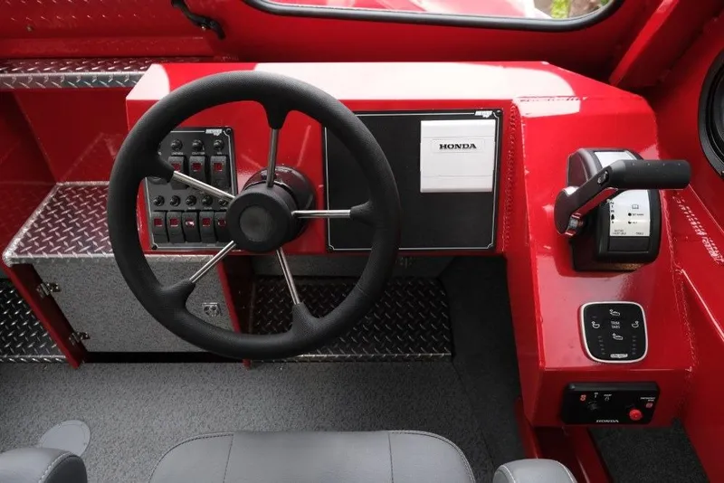 Slide: The Image of Steering console of 2026 Hewescraft 240 Ocean Pro ET Hardtop with Honda controls. - 15