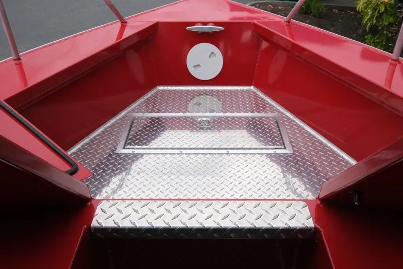 Slide: The Image of Red Hewescraft 240 Ocean Pro ET Hardtop boat interior with diamond plate flooring, 2026 model. - 16