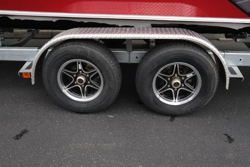 Slide: The Image of Trailer wheels of a 2026 Hewescraft 240 Ocean Pro ET Hardtop boat. - 19