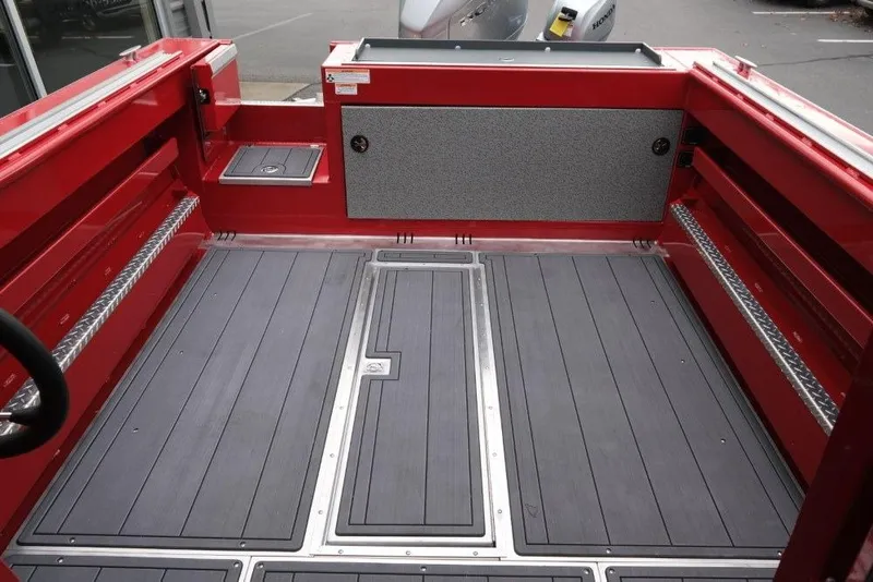 Slide: The Image of 2026 Hewescraft 240 Ocean Pro ET Hardtop boat interior with red accents and gray flooring. - 9
