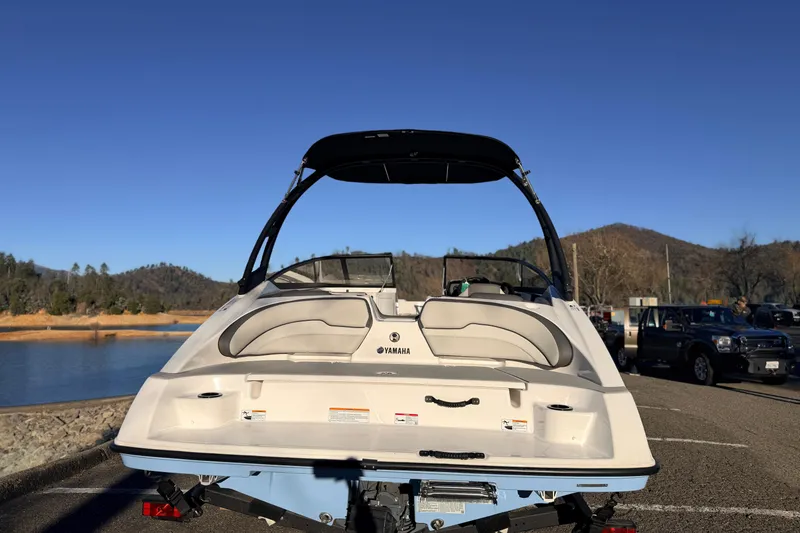 Slide: The Image of 2025 Yamaha Boats AR190 on trailer by a scenic lake and mountains. - 18