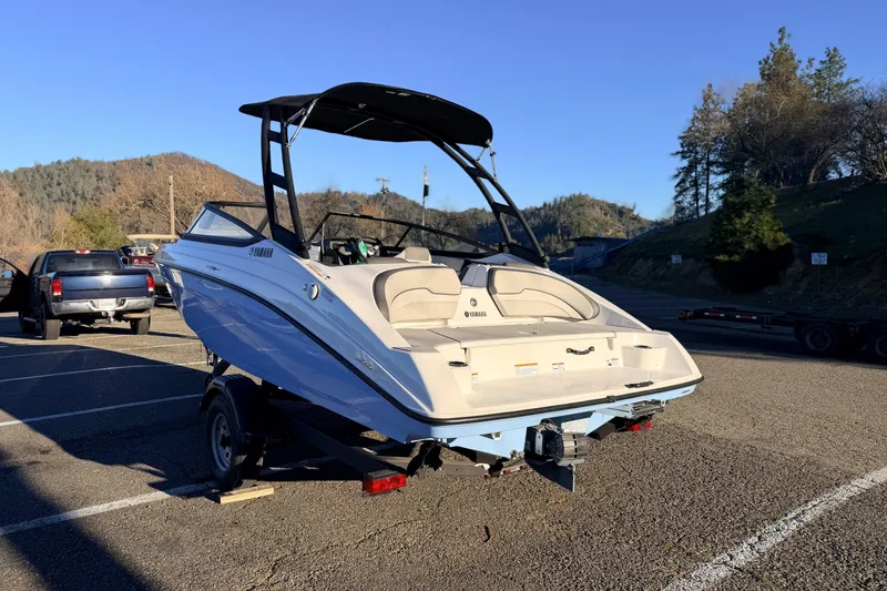 Slide: The Image of 2025 Yamaha Boats AR190 on trailer in sunny parking lot. - 19