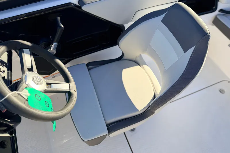 Slide: The Image of 2025 Yamaha Boats AR190 cockpit with steering wheel and comfortable seating. - 27