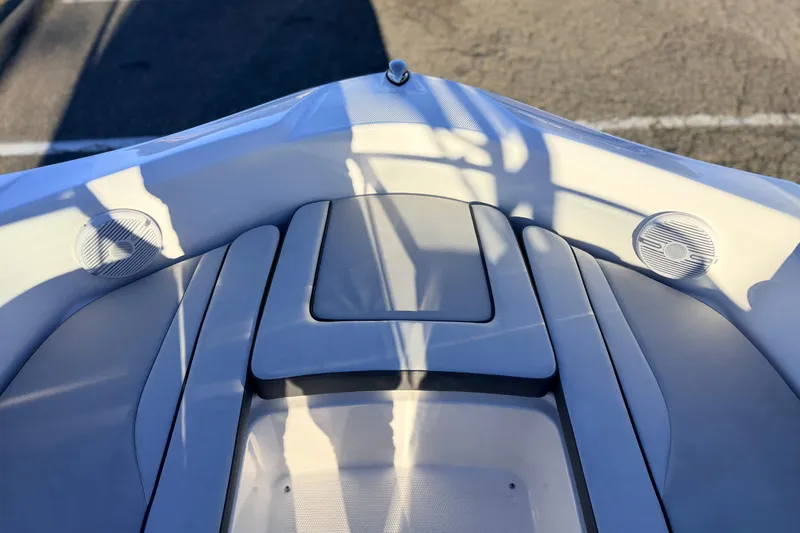 Slide: The Image of 2025 Yamaha Boats AR190 bow seating area with integrated speakers. - 32