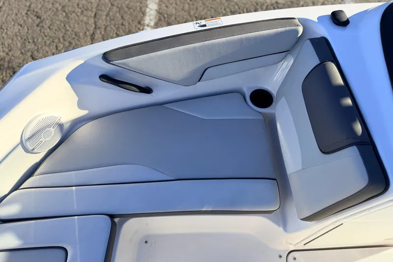 Slide: The Image of 2025 Yamaha Boats AR190 interior seating with speaker and cup holder. - 33