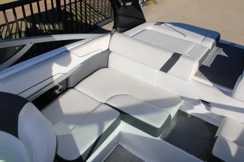 Slide: The Image of 2017 Regal 2100 Bowrider interior with white cushioned seating and sleek design. - 12