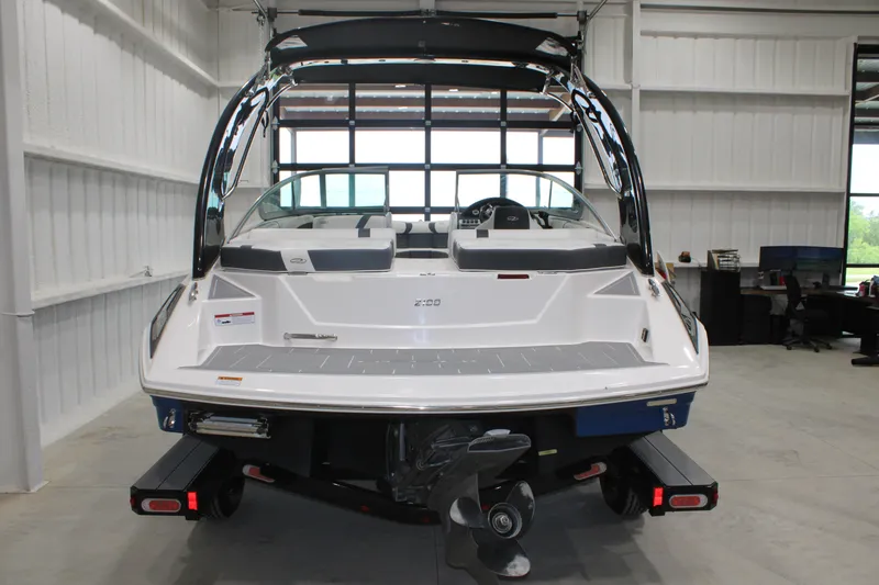 Slide: The Image of 2017 Regal 2100 Bowrider boat in a garage, rear view. - 15