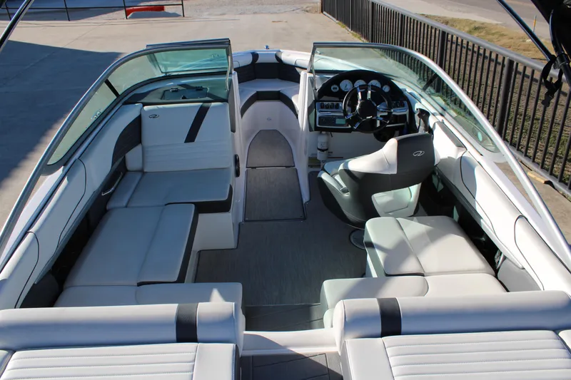 Slide: The Image of 2017 Regal 2100 Bowrider interior with sleek seating and modern dashboard design. - 8