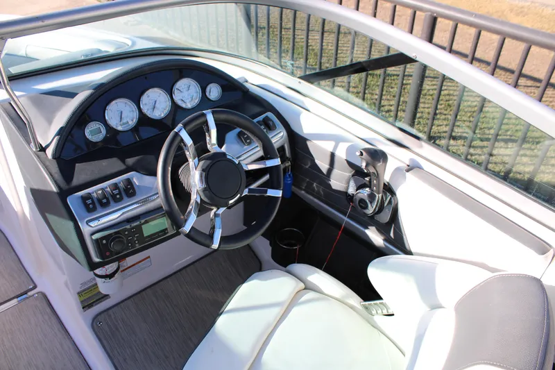 Slide: The Image of 2017 Regal 2100 Bowrider dashboard with steering wheel and control panel. - 9