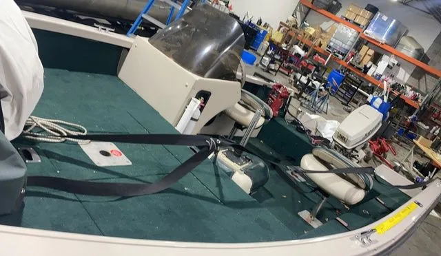 Slide: The Image of Interior view of a 1998 Crestliner Fish Hawk 1650 boat in a workshop. - 9