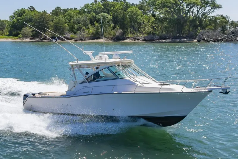 Slide: The Image of 2014 Grady-White Express 370 boat cruising on water. - 1