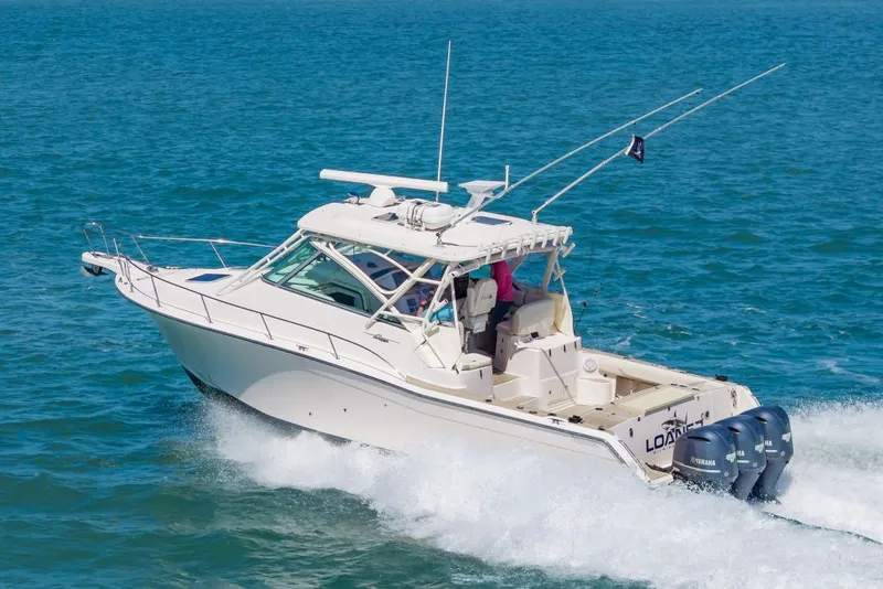 Slide: The Image of 2014 Grady-White Express 370 boat cruising on the sea. - 11