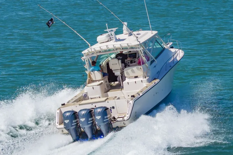 Slide: The Image of 2014 Grady-White Express 370 boat cruising on water. - 6