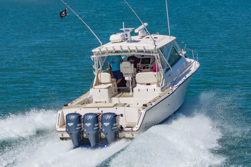 Slide: The Image of 2014 Grady-White Express 370 boat cruising on water. - 7