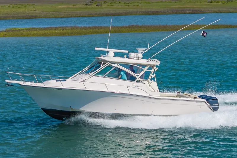 Slide: The Image of 2014 Grady-White Express 370 boat cruising on water. - 8