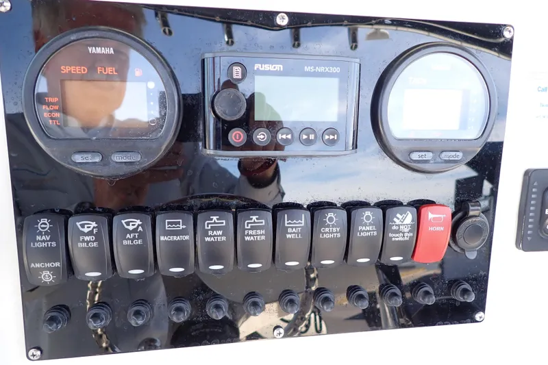Slide: The Image of Control panel of a 2006 Robalo R220 Center Console boat with Yamaha gauges. - 15
