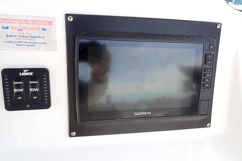 Slide: The Image of Garmin display and Lenco controls on 2006 Robalo R220 Center Console boat. - 16
