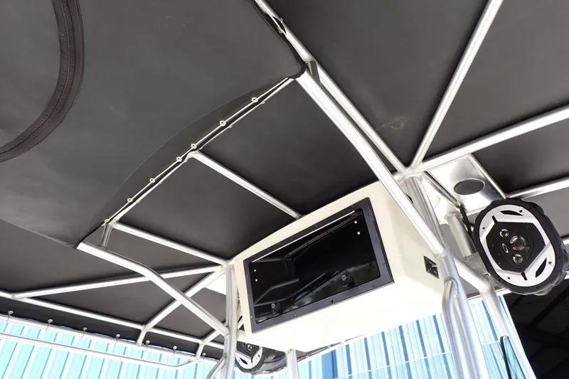 Slide: The Image of 2006 Robalo R220 Center Console boat interior with speakers and storage compartment. - 20