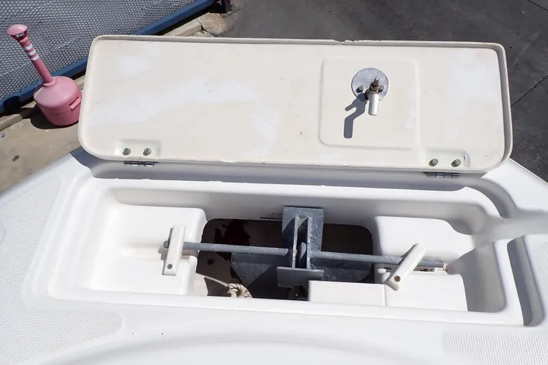 Slide: The Image of Open anchor compartment on 2006 Robalo R220 Center Console boat. - 27
