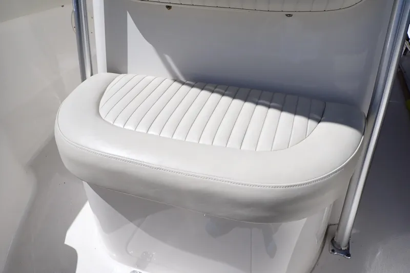 Slide: The Image of White cushioned seat on 2006 Robalo R220 Center Console boat. - 28