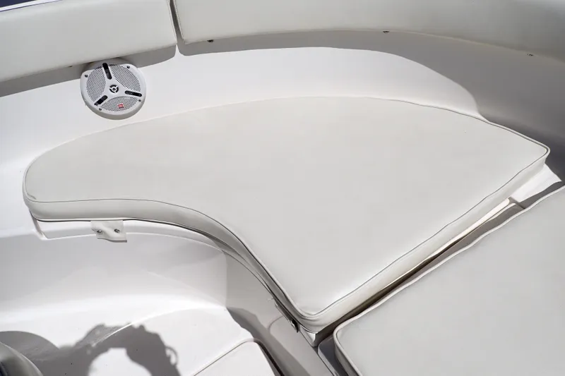 Slide: The Image of 2006 Robalo R220 Center Console boat interior with cushioned seating and speaker. - 32