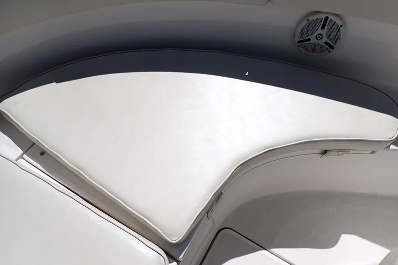 Slide: The Image of 2006 Robalo R220 Center Console boat interior with cushioned seating and speaker. - 34