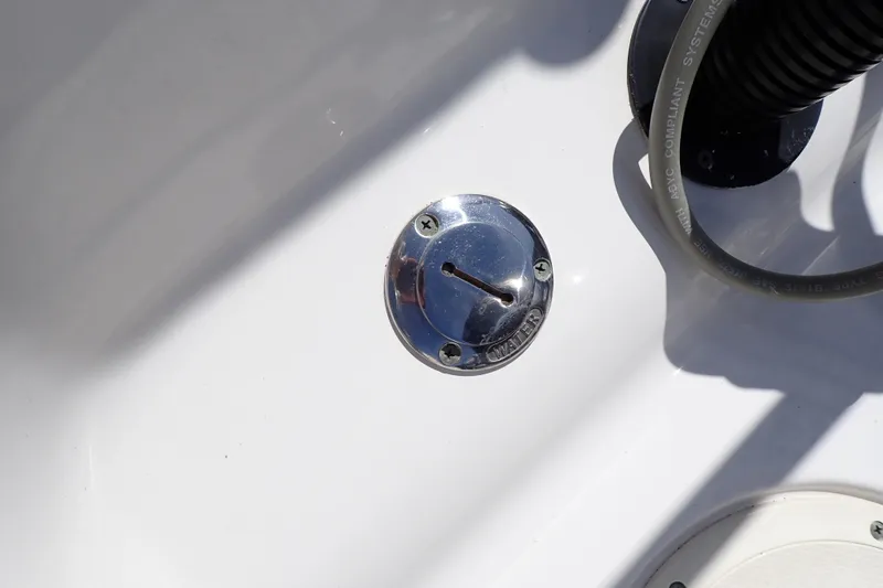 Slide: The Image of Chrome water fill cap on 2006 Robalo R220 Center Console boat deck. - 48