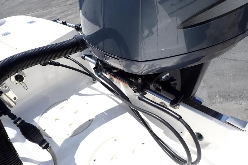 Slide: The Image of 2006 Robalo R220 Center Console boat engine and hydraulic steering system. - 49