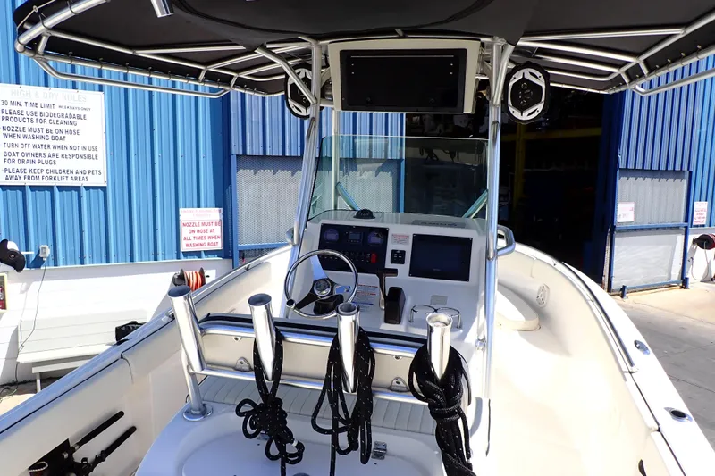 Slide: The Image of 2006 Robalo R220 Center Console boat interior with steering wheel and navigation equipment. - 5