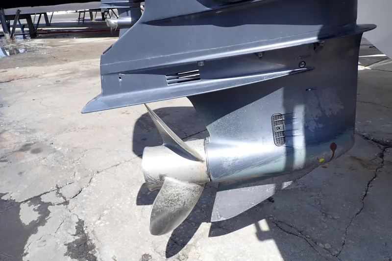 Slide: The Image of 2006 Robalo R220 Center Console boat propeller and lower unit detail. - 58