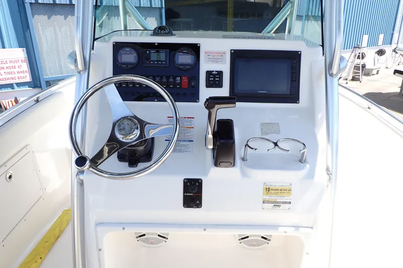 Slide: The Image of 2006 Robalo R220 Center Console dashboard with steering wheel, controls, and navigation display. - 6