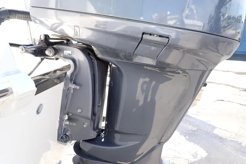 Slide: The Image of Outboard motor of a 2006 Robalo R220 Center Console boat, close-up view. - 60
