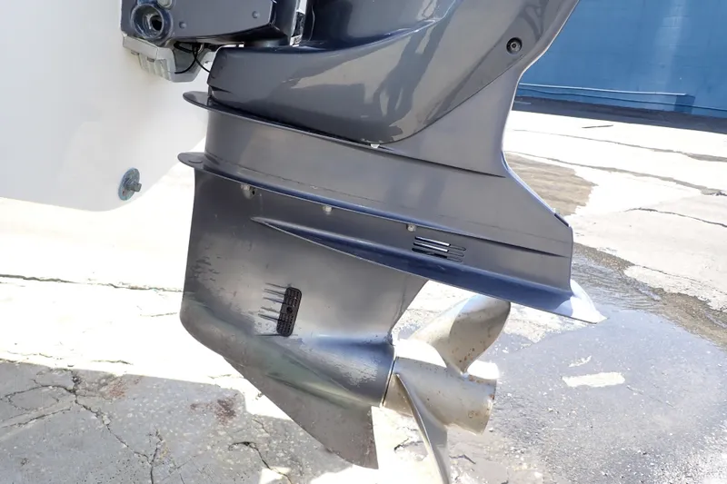 Slide: The Image of 2006 Robalo R220 Center Console boat motor and propeller detail. - 62