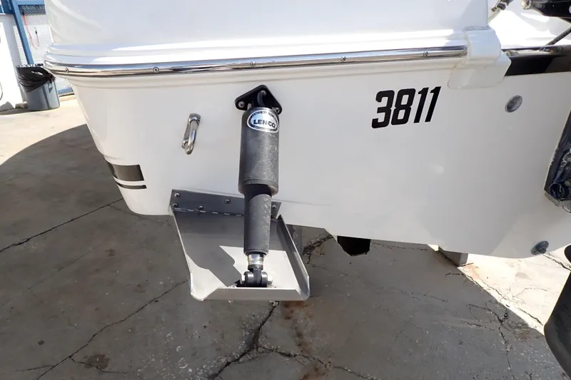 Slide: The Image of 2006 Robalo R220 Center Console boat with Lenco trim tab and number 3811. - 63
