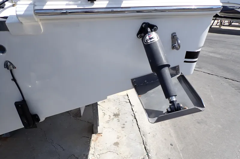 Slide: The Image of 2006 Robalo R220 Center Console boat with trim tab detail. - 64