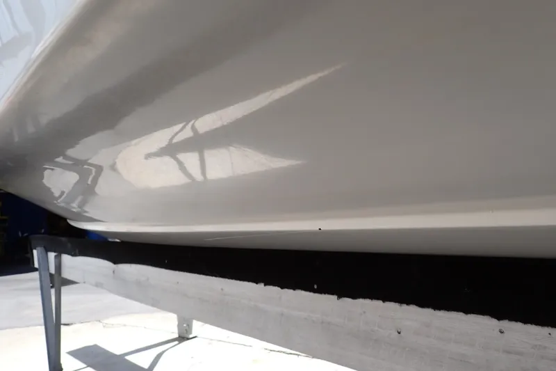 Slide: The Image of 2006 Robalo R220 Center Console boat hull on a stand, reflecting light. - 67