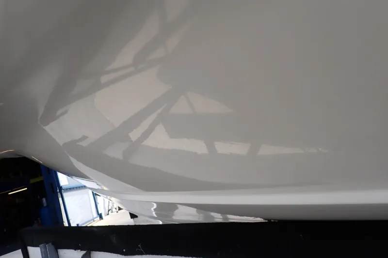 Slide: The Image of Close-up of 2006 Robalo R220 Center Console boat hull in a workshop. - 68