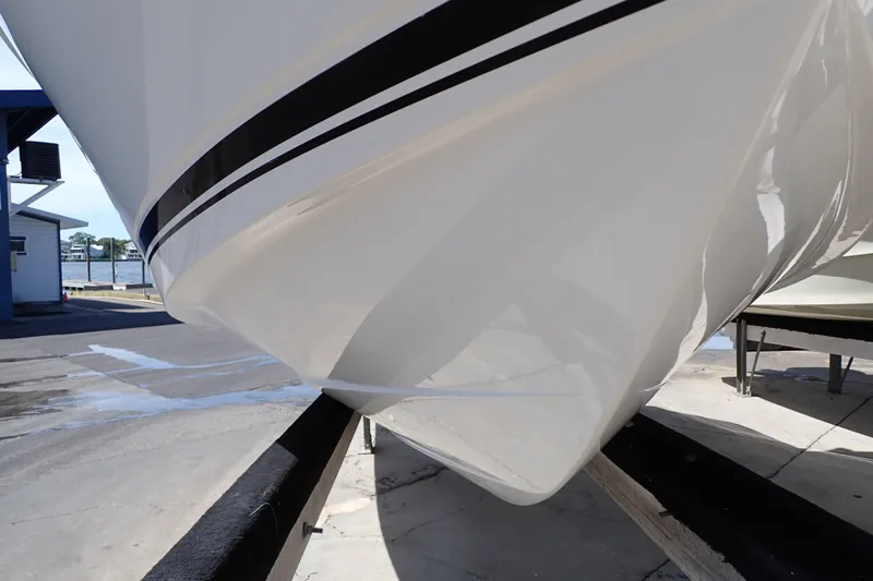 Slide: The Image of 2006 Robalo R220 Center Console boat hull on trailer, close-up view. - 71