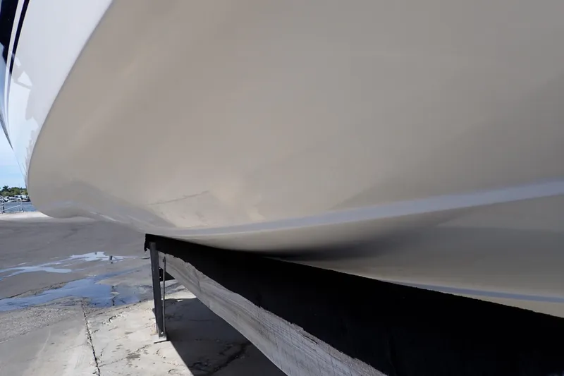 Slide: The Image of 2006 Robalo R220 Center Console boat hull on a trailer, side view. - 72