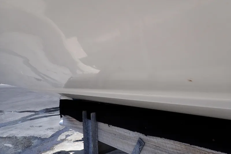 Slide: The Image of 2006 Robalo R220 Center Console boat hull on a support stand. - 74