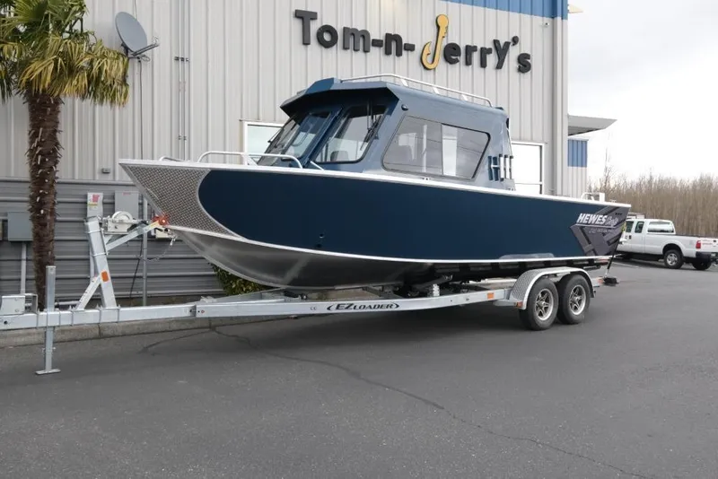The Image of 2026 Hewescraft 240 Ocean Pro ET Hardtop boat on trailer outside dealership. - 1