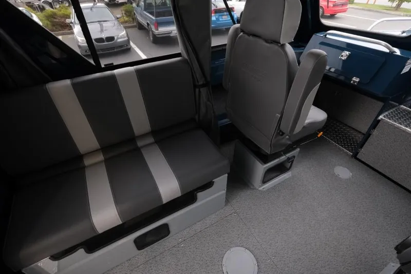 Slide: The Image of Interior of 2026 Hewescraft 240 Ocean Pro ET Hardtop, featuring seating and dashboard. - 10