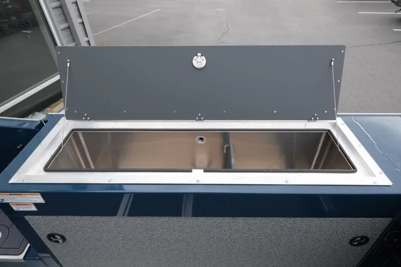 Slide: The Image of Open storage compartment on 2026 Hewescraft 240 Ocean Pro ET Hardtop boat. - 16