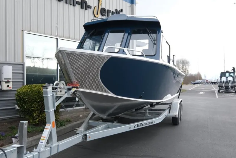 Slide: The Image of 2026 Hewescraft 240 Ocean Pro ET Hardtop boat on trailer outside dealership. - 3