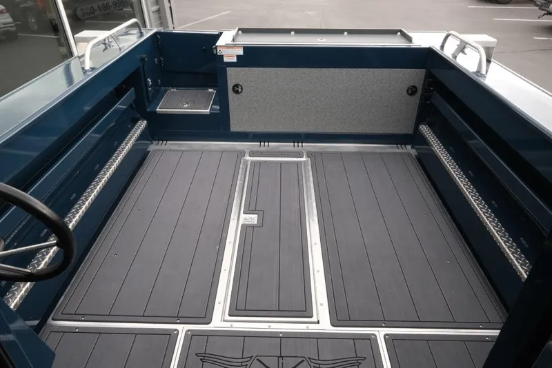 Slide: The Image of 2026 Hewescraft 240 Ocean Pro ET Hardtop boat interior with spacious deck and storage. - 7
