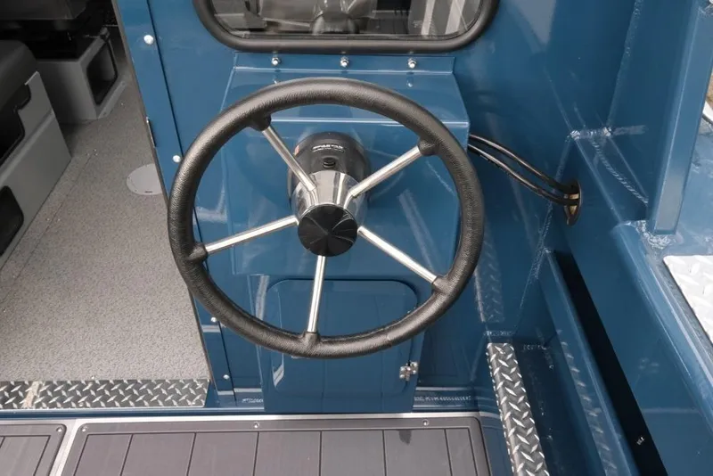 Slide: The Image of Steering wheel of 2026 Hewescraft 240 Ocean Pro ET Hardtop boat interior. - 8