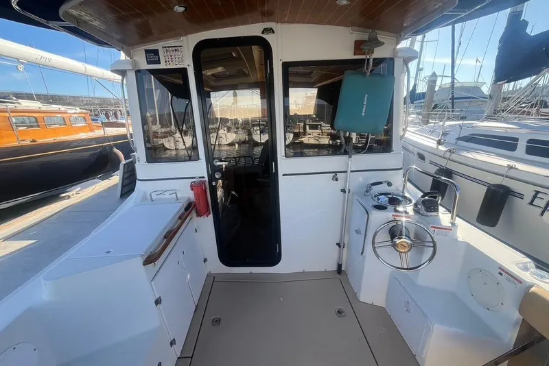 Slide: The Image of 2013 Cutwater C-28 boat cockpit with helm, docked at marina. - 15